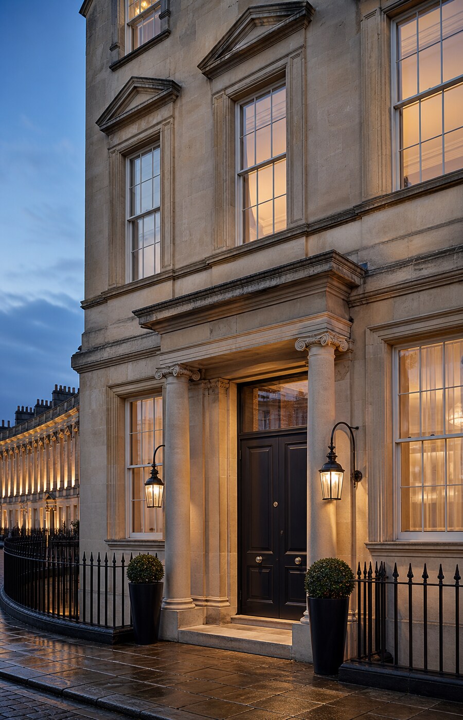 The Georgian limestone façade of the hotel at dusk